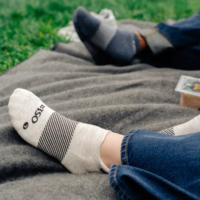 person wearing mushroom wicked comfort merino wool performance sock no show length while on a picnic | OS1st