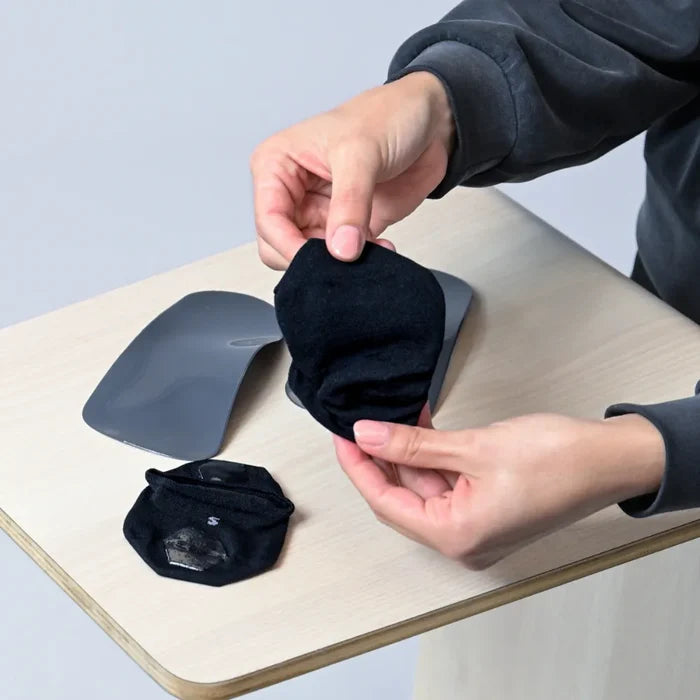use an orthotic sock to wear with your orthotic to reduce/and or prevent squeaking, and reduce sweat | OS1st 
wrap sock around orthotic/insole with the silicone grips on the outside, bottom (so that they are touching the shoe)