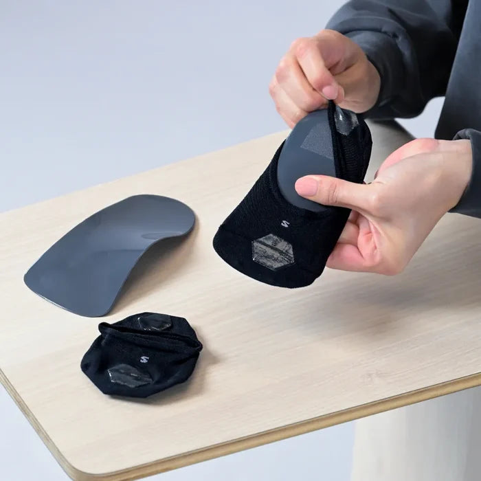 use an orthotic sock to wear with your orthotic to reduce/and or prevent squeaking, and reduce sweat | OS1st 
wrap sock around orthotic/insole with the silicone grips on the outside, bottom (so that they are touching the shoe)
