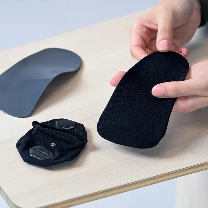 use an orthotic sock to wear with your orthotic to reduce/and or prevent squeaking, and reduce sweat | OS1st 
wrap sock around orthotic/insole with the silicone grips on the outside, bottom (so that they are touching the shoe)