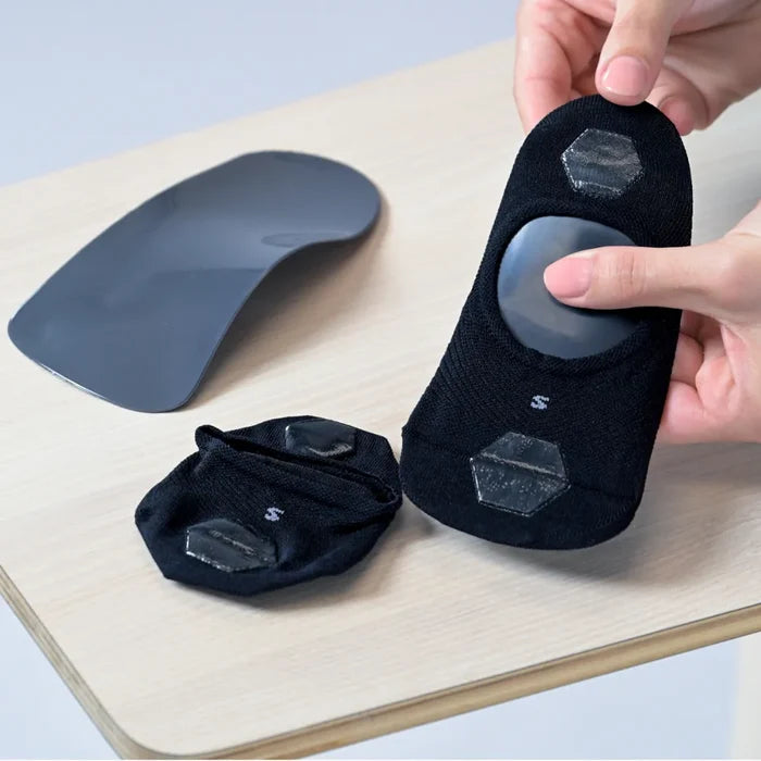 use an orthotic sock to wear with your orthotic to reduce/and or prevent squeaking, and reduce sweat | OS1st 
wrap sock around orthotic/insole with the silicone grips on the outside, bottom (so that they are touching the shoe)